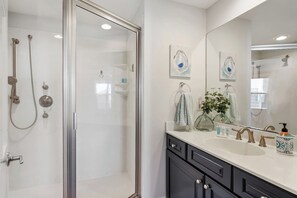 Combined shower/tub, hair dryer, towels, soap