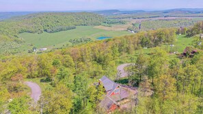 A rural landscape with a house surrounded by trees and fields. - Eagle's Rest by Taylor Made Deep Creek (McHenry)