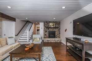 40-inch TV with cable channels, fireplace