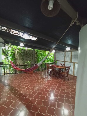 Outdoor dining - Experience comfort and relaxation in our air-conditioned apartment, featuring two spacious bedrooms, a welcoming living room, a fully equipped private kitchen, and a well-appointed private bathroom. Perfect for families or groups. (Belmopan)