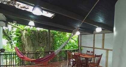 Experience comfort and relaxation in our air-conditioned apartment, featuring two spacious bedrooms, a welcoming living room, a fully equipped private kitchen, and a well-appointed private bathroom. Perfect for families or groups.