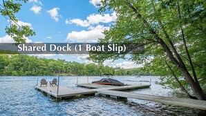 A shared dock with a boat slip. - Stay Awhile by Taylor Made Deep Creek (McHenry)