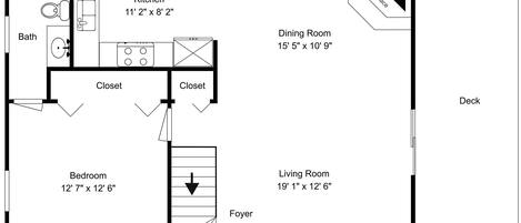 A floor plan with a kitchen, dining room, living room, bedroom, two closets, a foyer, and a fireplace.