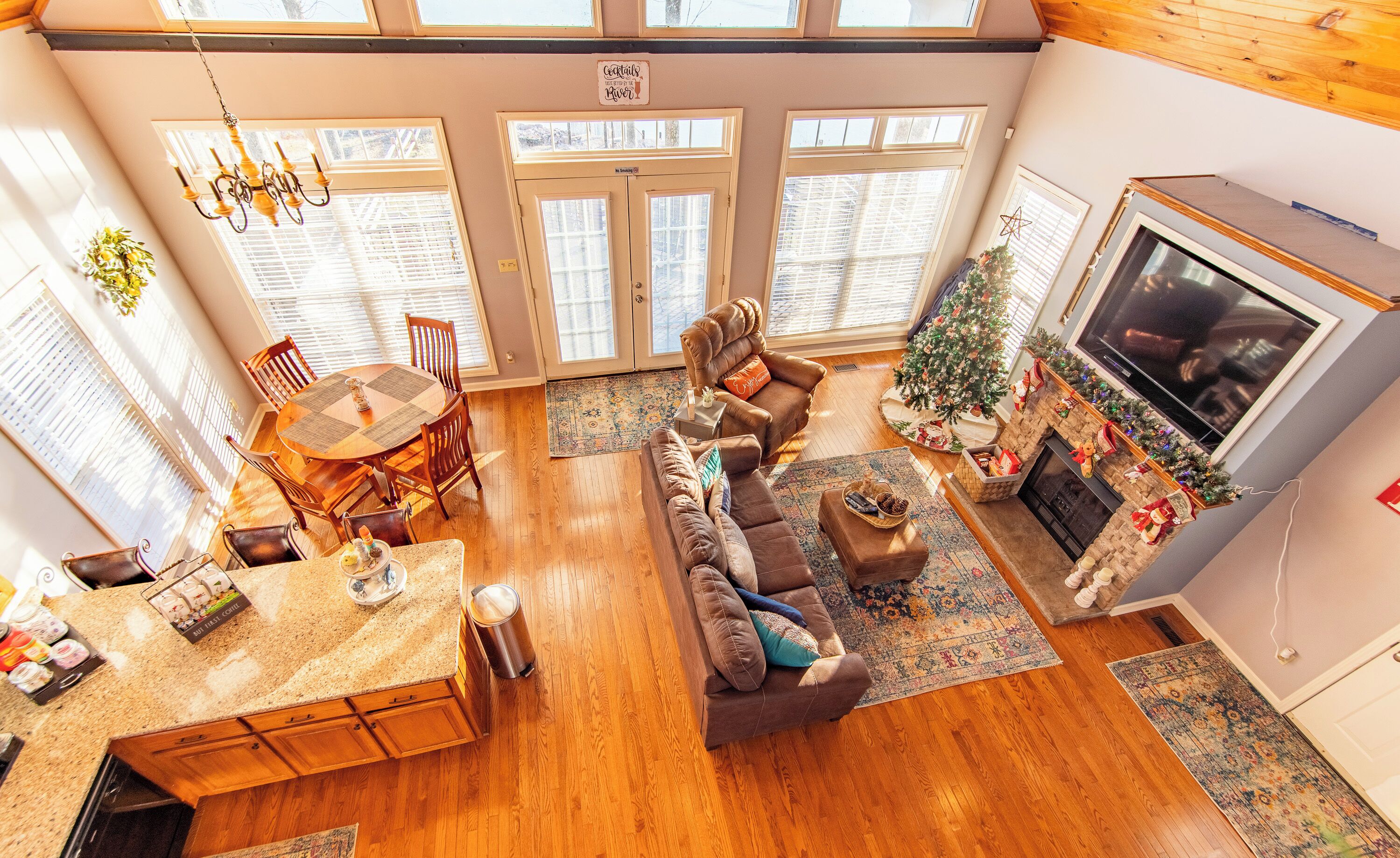 A spacious living room with a fireplace, a dining area, and a cozy seating area.