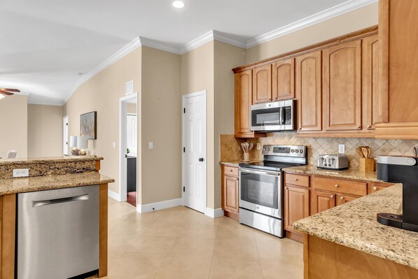Fridge, microwave, oven, stovetop - Professional Designed Home on Freshwater Canel with Saltwater Pool!  (Cape Coral)