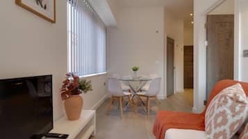 Apartment | Living area | 30-inch TV with digital channels