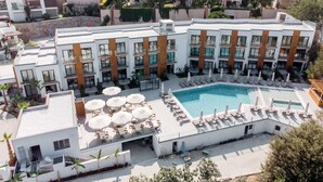 A modern hotel with a rooftop pool, multiple balconies, and outdoor seating areas. - Bodrum Astrid Hotel  (Bodrum)