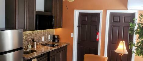 Fridge, microwave, stovetop, coffee/tea maker