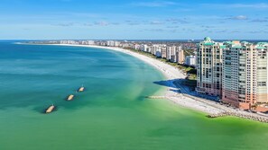 On the beach, sun loungers, beach towels