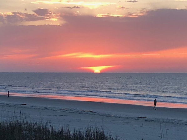 Guests can enjoy a serene beach experience with calm ocean views.