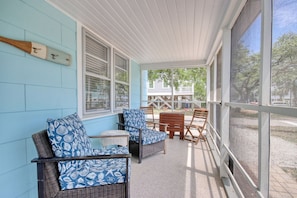 Relax on the porch with wicker furniture and enjoy the view.
