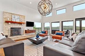 Smart TV, fireplace, books, stereo