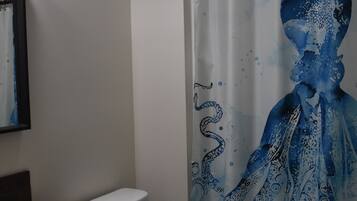 Combined shower/bathtub, hair dryer, towels, soap