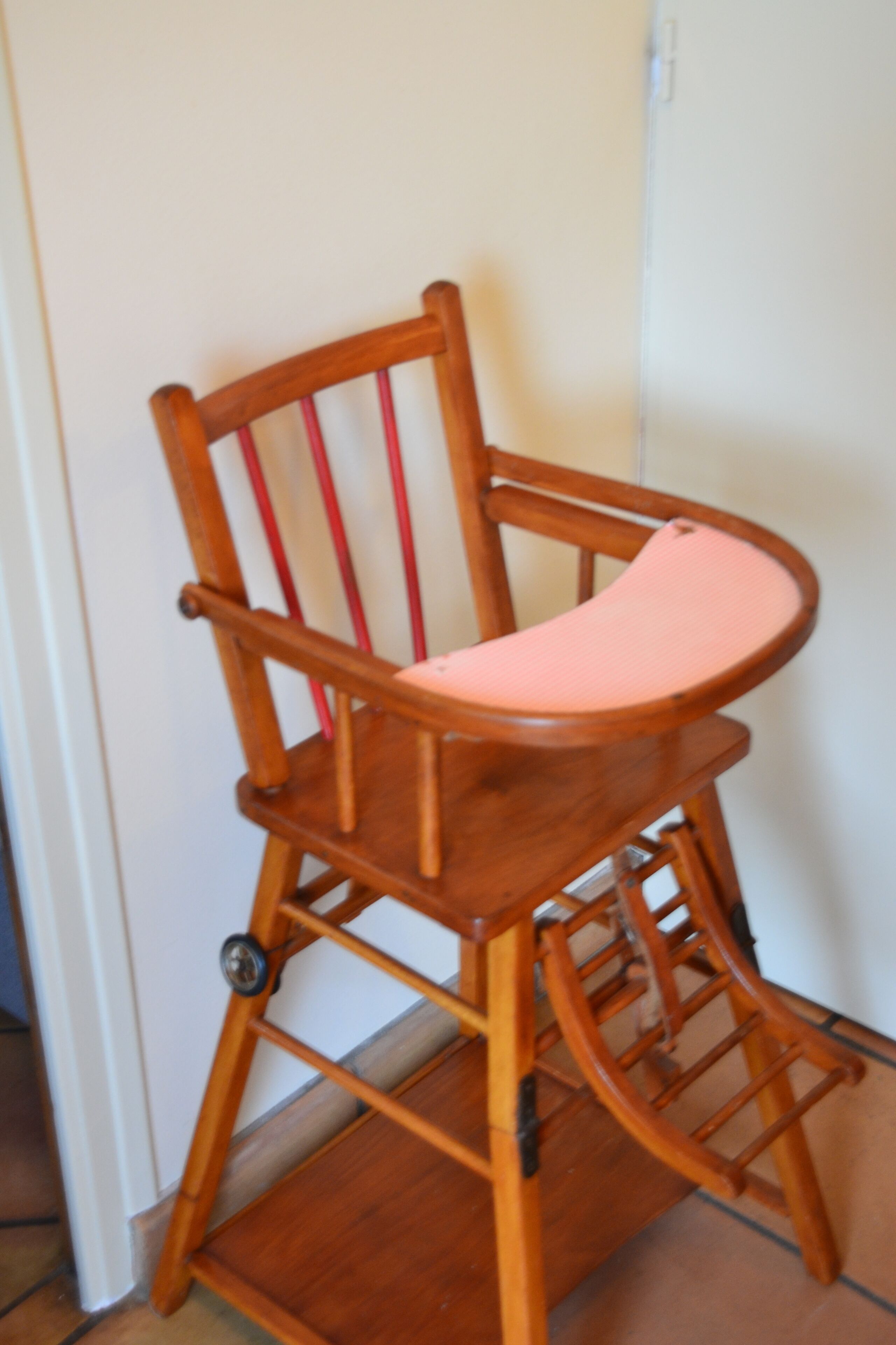 A wooden chair with a curved backrest and a cushioned seat.