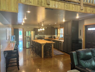 Spacious home with additional camper hook ups on 10 private acres. 