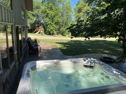 Spacious home with additional camper hook ups on 10 private acres. 