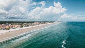 On the beach, sun loungers, beach towels