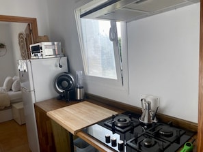 Fridge, microwave, stovetop, coffee/tea maker