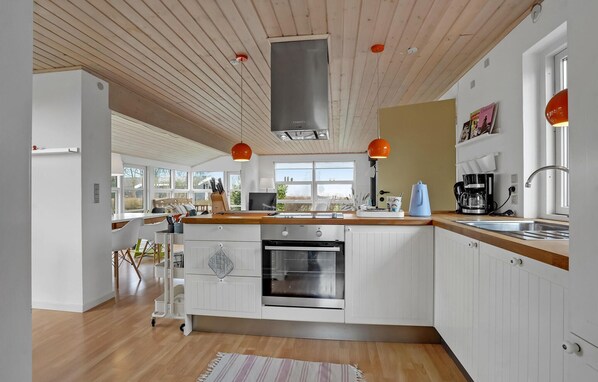 Fridge, stovetop, dishwasher, coffee/tea maker