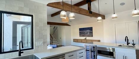 Fridge, dining tables, kitchen islands