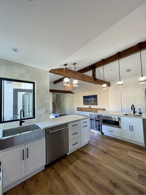 Fridge, dining tables, kitchen islands