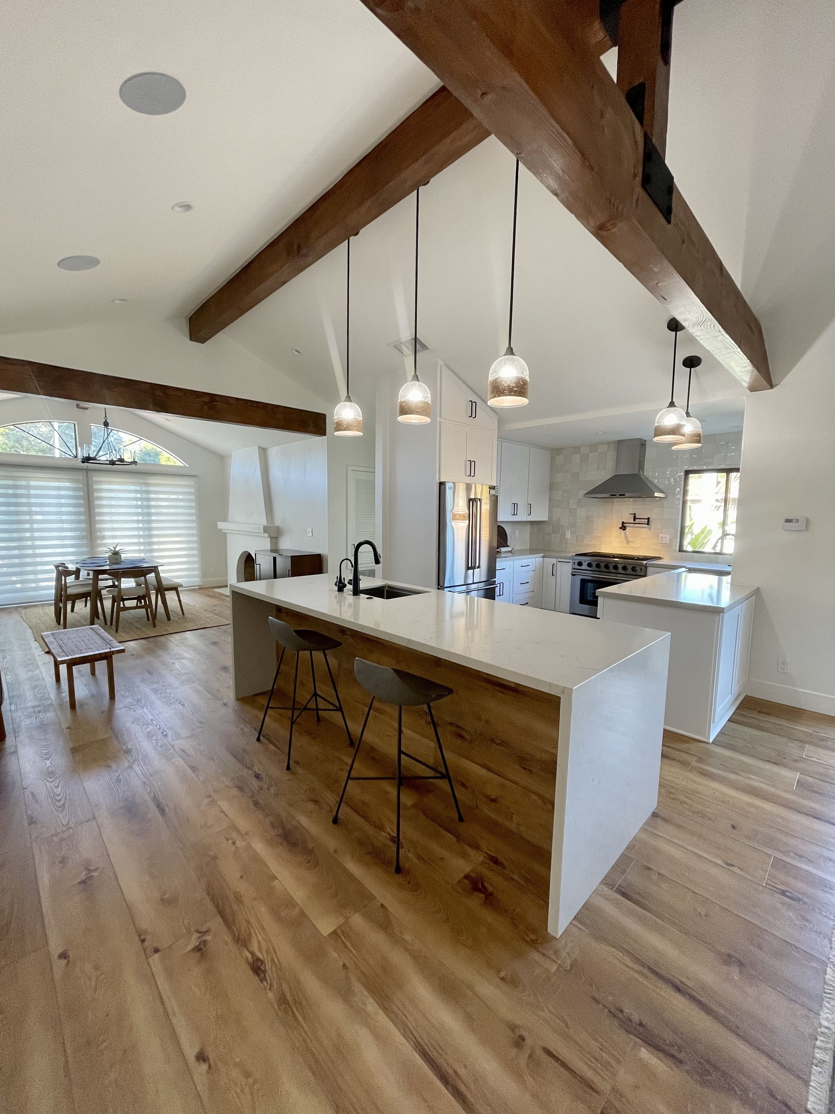 Fridge, dining tables, kitchen islands