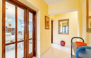 Enter a warm and inviting space with a dining area just beyond the door.