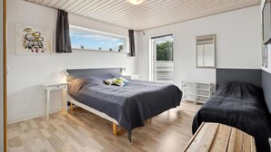 A bedroom with a bed, bedside tables, a window, and a view of greenery outside. - Awesome home in Toftlund with WiFi (Toftlund)