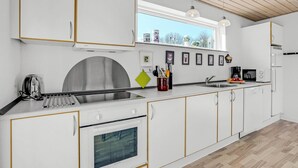 A modern kitchen with white cabinets, a stainless steel range, and a built-in oven. - Awesome home in Toftlund with WiFi (Toftlund)