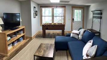 Smart TV, fireplace, foosball, books