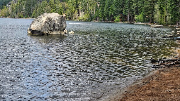 A lake with a large rock in the center, surrounded by dense forest and hills. - SNOW, SNOW & MORE SNOW AND SUGAR BEAR IS PLOWED! 12 MIN TO DODGE, 5 MIN TO SLED (Cold Springs)