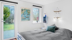 A bedroom with a bed, a window, and a door. - Nice home in Hurup Thy with kitchen (Hurup Thy)