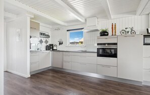 Fridge, stovetop, dishwasher, coffee/tea maker