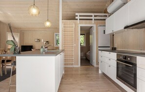 Fridge, stovetop, dishwasher, coffee/tea maker