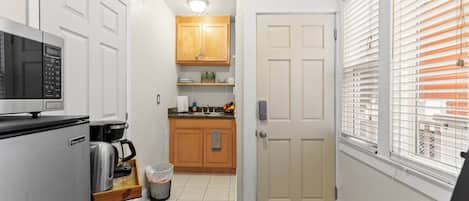 Fridge, microwave, electric kettle, cookware/dishes/utensils