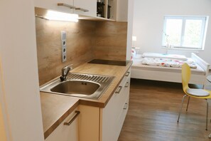 1 bedroom, desk, iron/ironing board, travel crib