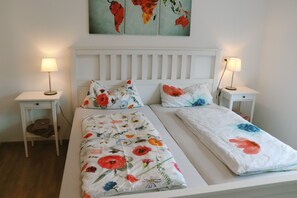 1 bedroom, desk, iron/ironing board, travel crib