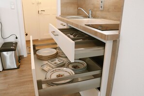 Fridge, microwave, stovetop, coffee/tea maker