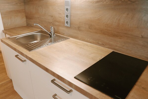 Fridge, microwave, stovetop, coffee/tea maker