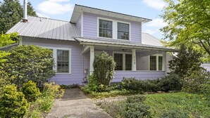 A two-story house with a covered porch and a chimney. - Walk to Downtown Brevard  Pets Welcome Large Fenced Yard Porches Biking Hiking (Brevard)
