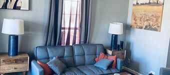 Modern and Cozy Apartment with large windows and sunlight.