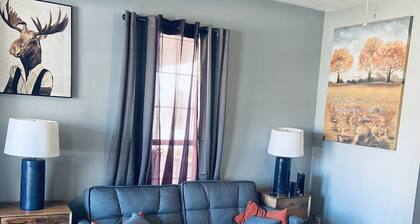 Modern and Cozy Apartment with large windows and sunlight.