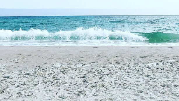 A beach with waves crashing onto the shore under a clear sky. - Excellent Location, Beautiful House Sleeps 10 and Will Feel Like Home!  (Orange Beach)