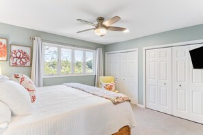 A bedroom with a bed, a ceiling fan, a window, and a wardrobe. - Beautiful Marsh & Golf view. Walking distance to the beach & Conference Center. (Isle of Palms)