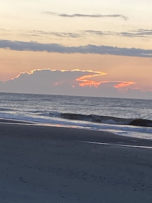 A beach with waves and a sunset. - Beautiful Marsh & Golf view. Walking distance to the beach & Conference Center. (Isle of Palms)
