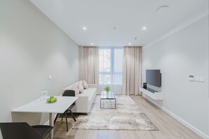 Apartamento, 1 quarto | Área de estar | Smart TV 50 polegadas com canais digitais, TV