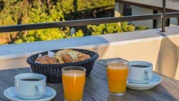 A table with breakfast items and a view of a historic building.