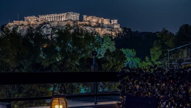 A night view of a historic building with a moon in the sky. - Acropolis Vision (Athens)
