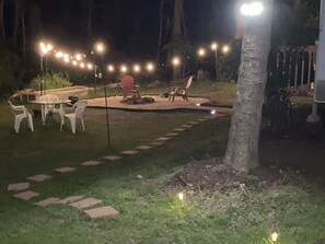 Outdoor dining - Glamping at it's best! Sleeps 4, Porch w/grill Fire pit Big outdoor living space (High Point)