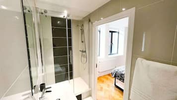 Bathtub, hair dryer, towels, soap